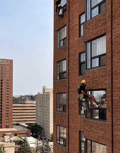 Window-Cleaning-Edmonton-Brick-Building_mob_hero High-Rise-Window-Cleaning-in-Edmonton